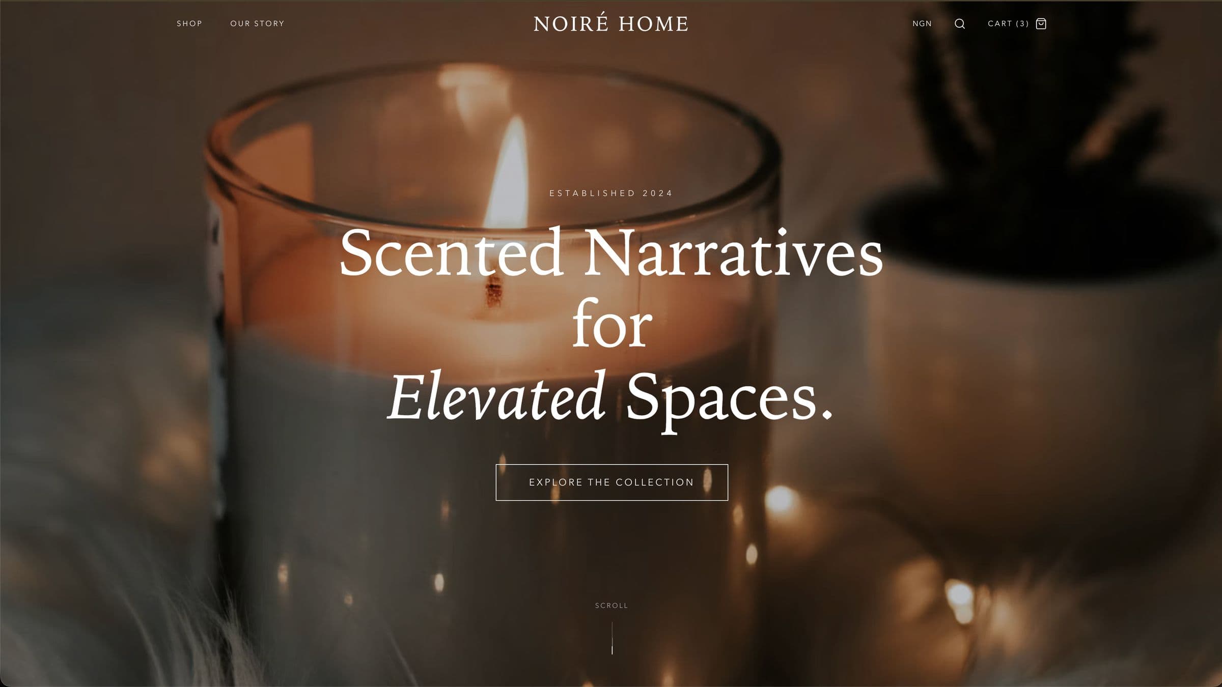 Noiré Home storefront hero with a lit candle and the headline Scented Narratives for Elevated Spaces